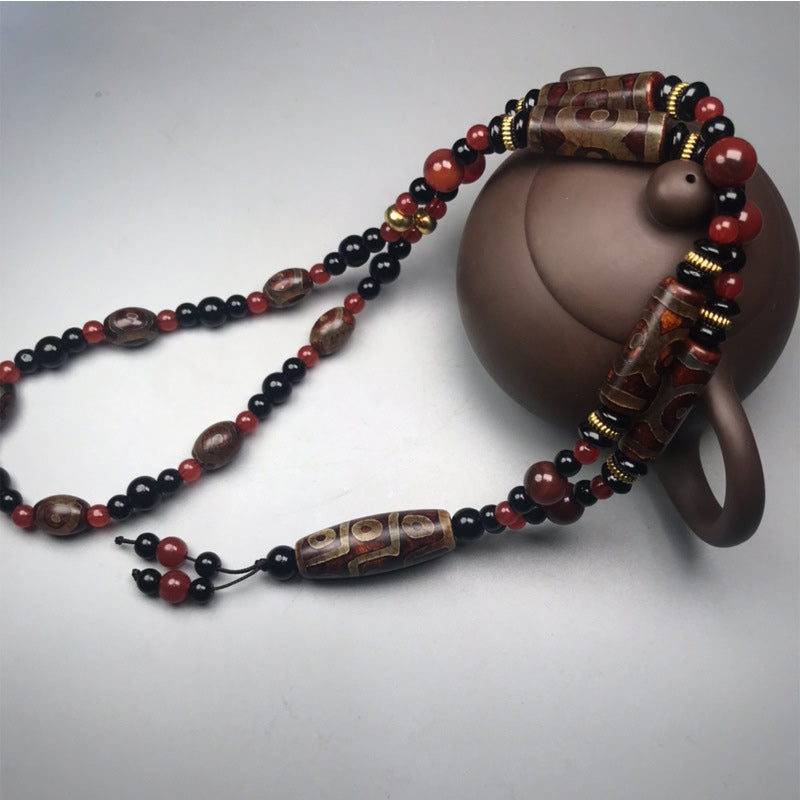 Carmiora Nine-Eye Dzi Bead Red Agate Wealth Health Halskette
