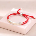 Carmiora-Armband aus 925er-Sterlingsilber mit roter Schnur und geschichtetem Zopf