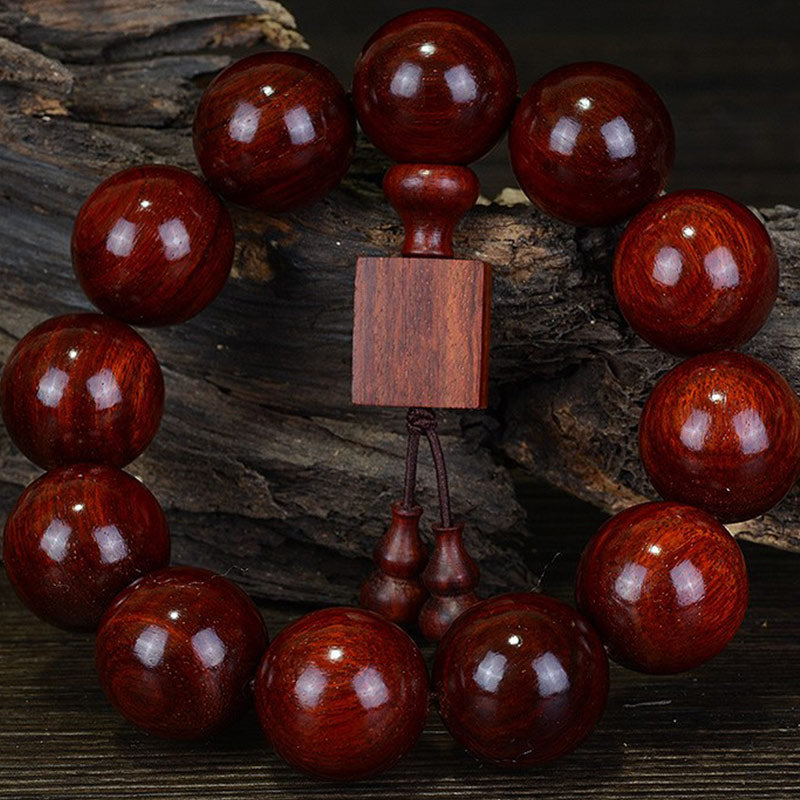 Carmiora Tibetisches kleines Blatt-Entspannungsarmband aus rotem Sandelholz