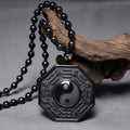 Halskette mit Yin-Yang-Anhänger aus schwarzem Obsidianstein von Carmiora