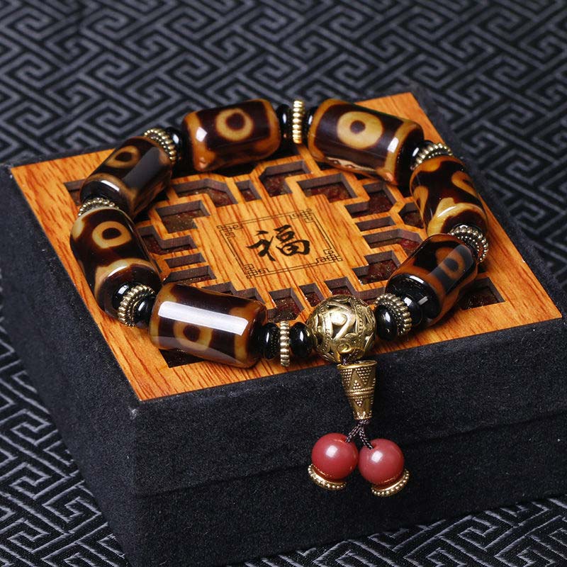 Carmiora Tibetisches Neun-Augen-Dzi-Perlen-Glücks-Charm-Armband