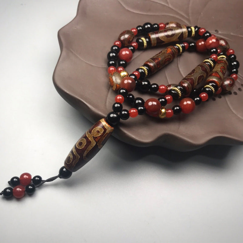 Carmiora Nine-Eye Dzi Bead Red Agate Wealth Health Halskette