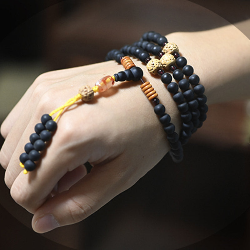 Carmiora tibetisches Mala-Zypressen-Bodhi-Samen-Heilarmband aus rotem Achat