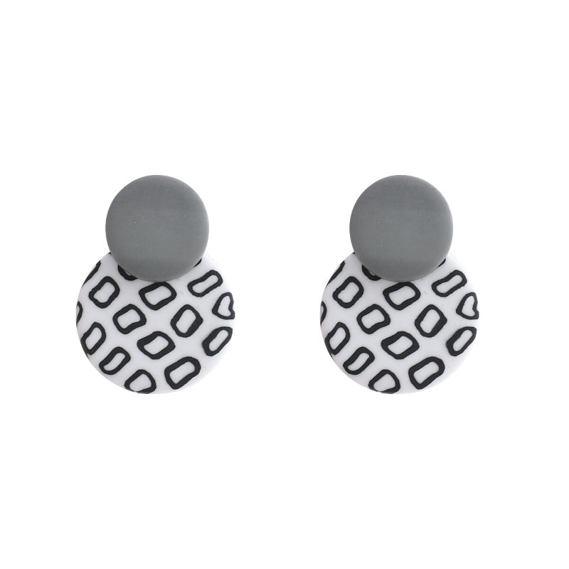 Anspruchsvolle Statement-Ohrring-Kollektion mit schwarzen und weißen Punkten