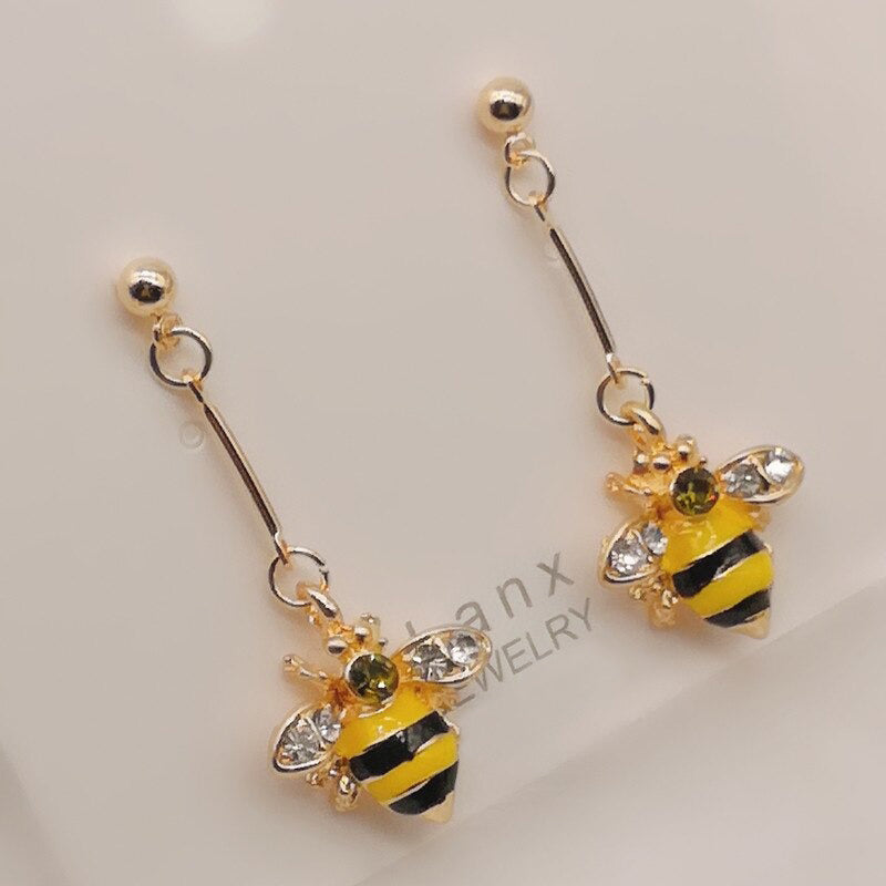 Entzückende Emaille-Ohrhänger mit Bienen- und Honigwabenmotiv