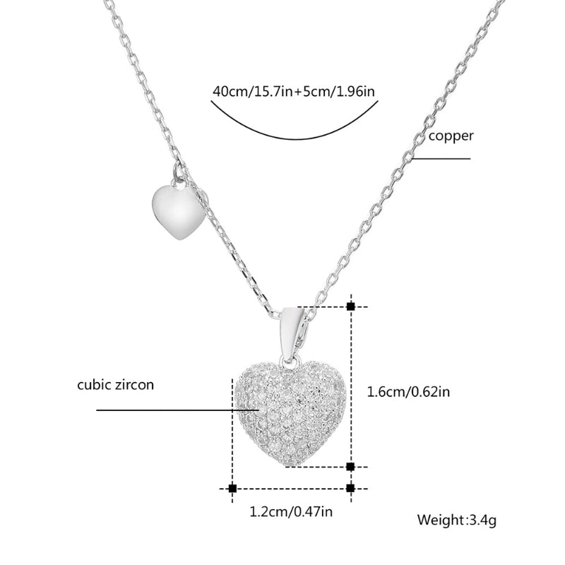 Verführerische mit Zirkonen verzierte Herz-Ohrhänger und Halsketten