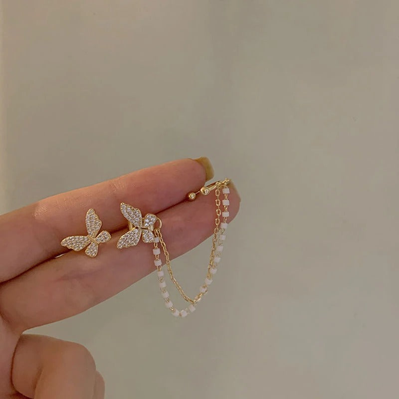 Asymmetrische Schmetterlings-Glamour-Ohrringe mit Strasssteinen und Kette