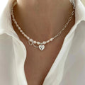 Asymmetrische Halsketten mit Perlen und Kette und Herzanhänger