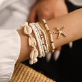 Stapelarmband mit Strandmotiv im Boho-Stil – Muschel- und Seestern-Anhänger in Gold