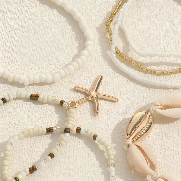 Stapelarmband mit Strandmotiv im Boho-Stil – Muschel- und Seestern-Anhänger in Gold