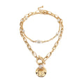 Goldene Halskette mit Knebelverschluss und Perlen – Schicker mehrlagiger Modeschmuck