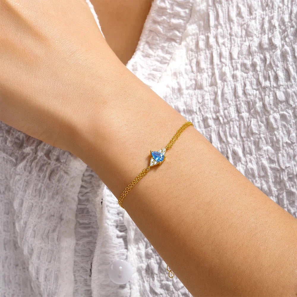 Luxuriöses Damen-Goldkettenarmband mit blauem Topas – verstellbarer Verschluss