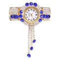 Armbanduhr mit Schmucksteinen und Strasssteinen