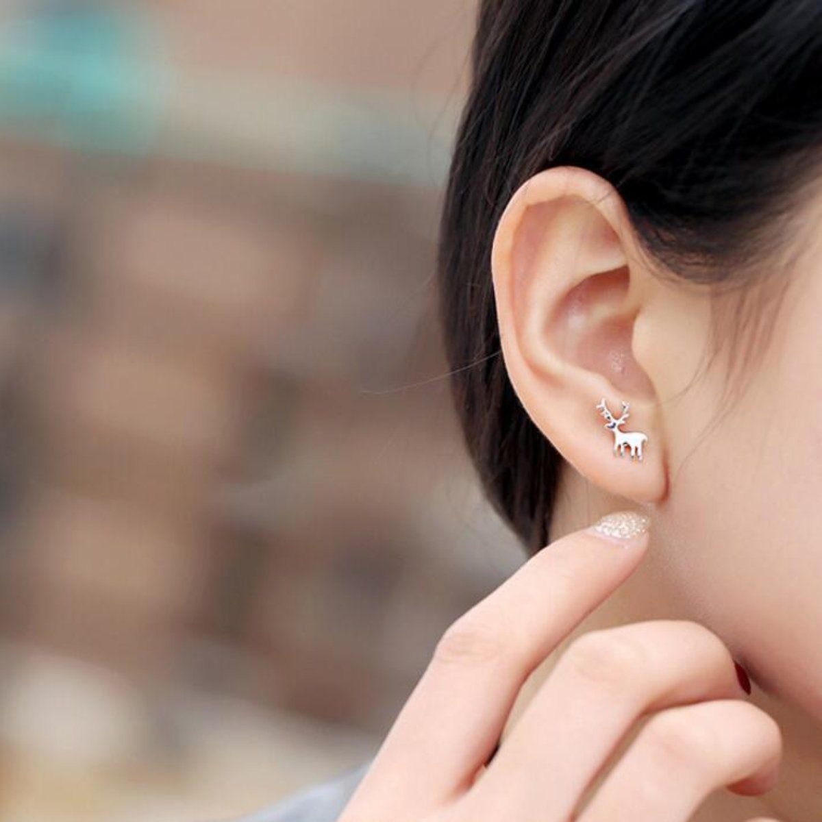 Asymmetrische Ohrringe mit Weihnachtsmann-Motiv