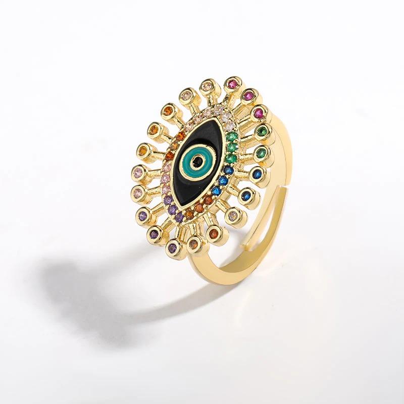 Bunte Strasssteine mit Glücksaugen-Ringen
