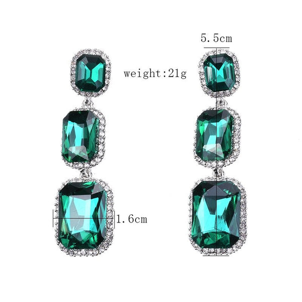 Lange, mit bunten Strasssteinen besetzte Tropfenohrringe