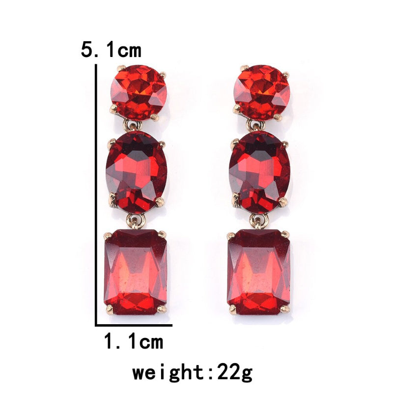 Lange, mit bunten Strasssteinen besetzte Tropfenohrringe