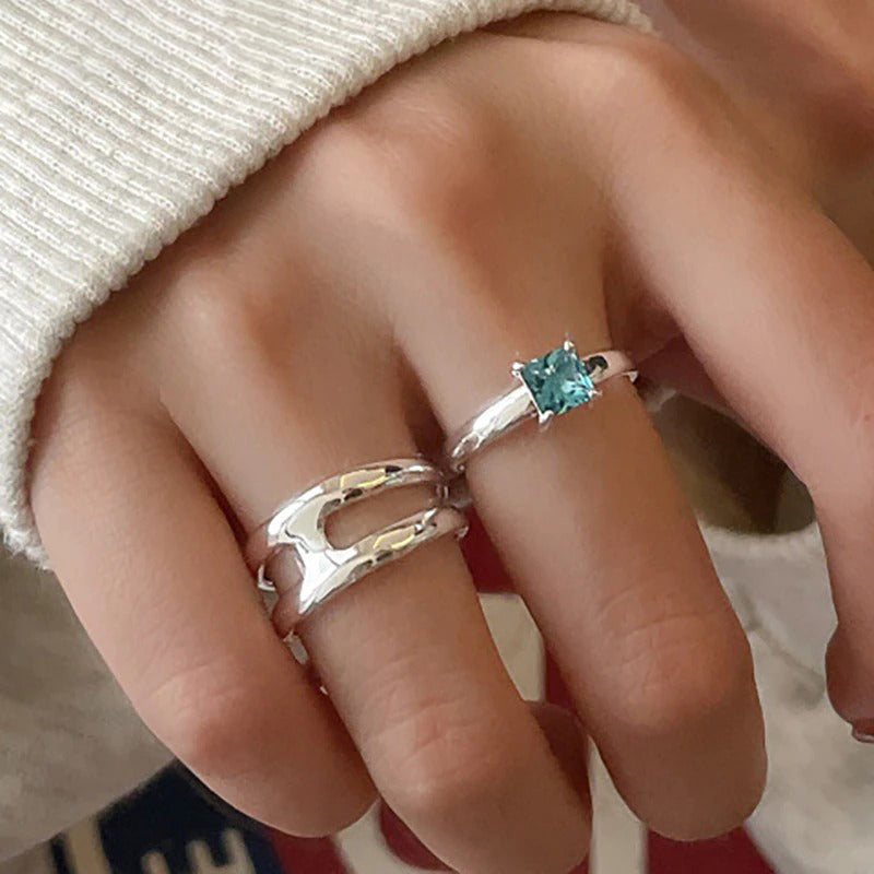 Kreative doppellagige Paarringe mit blauem Zirkon