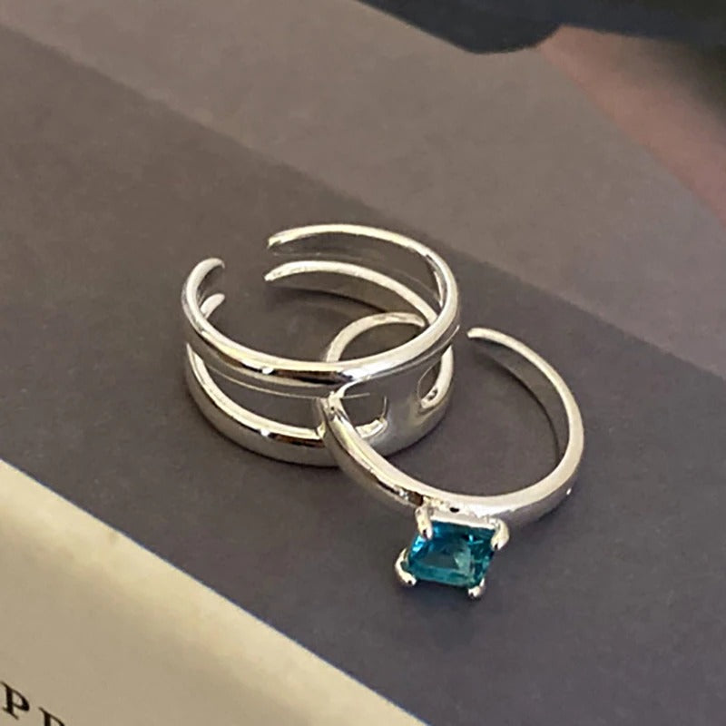 Kreative doppellagige Paarringe mit blauem Zirkon