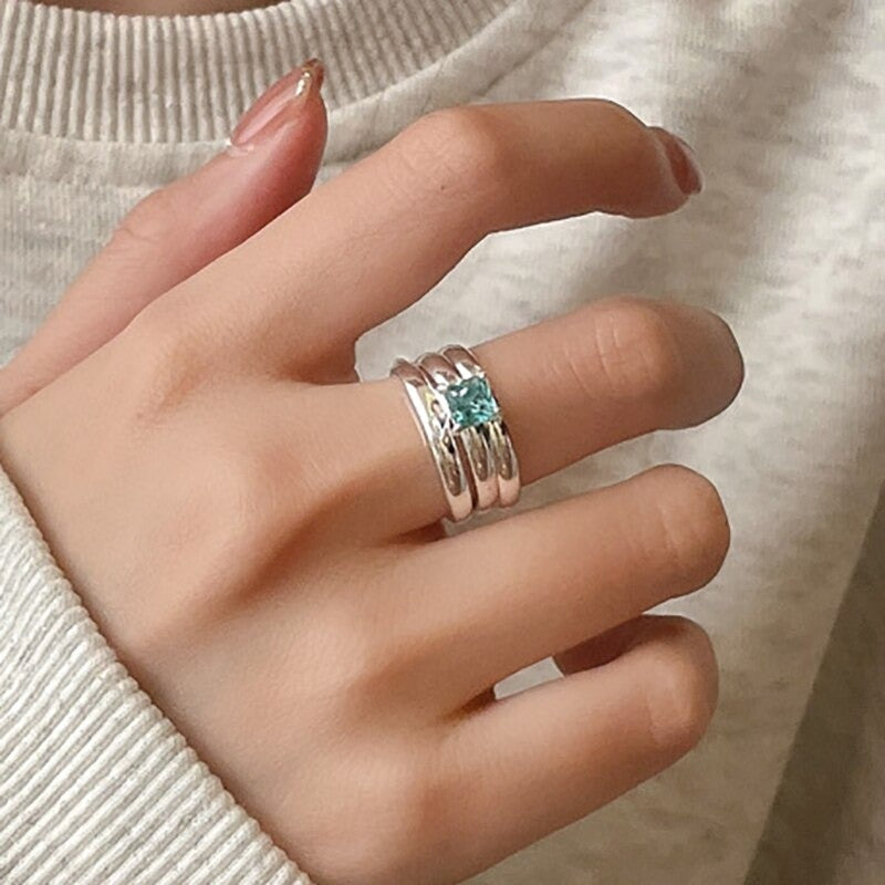 Kreative doppellagige Paarringe mit blauem Zirkon