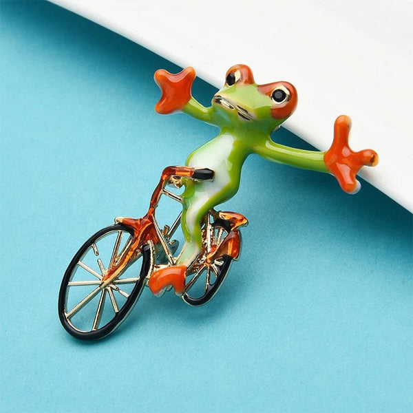 Niedliche Broschennadeln mit Fahrradfrosch