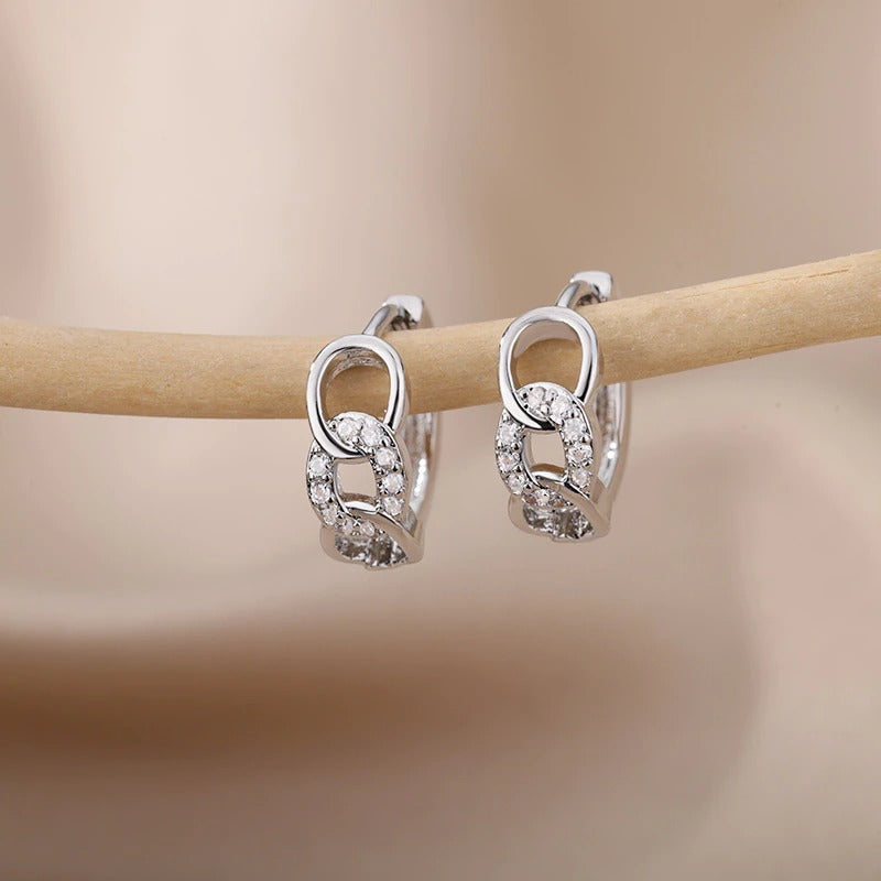 Kollektion zierlicher Creolen aus Edelstahl mit Herz-Zirkon