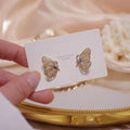 Elegante glitzernde Schmetterlingsohrringe