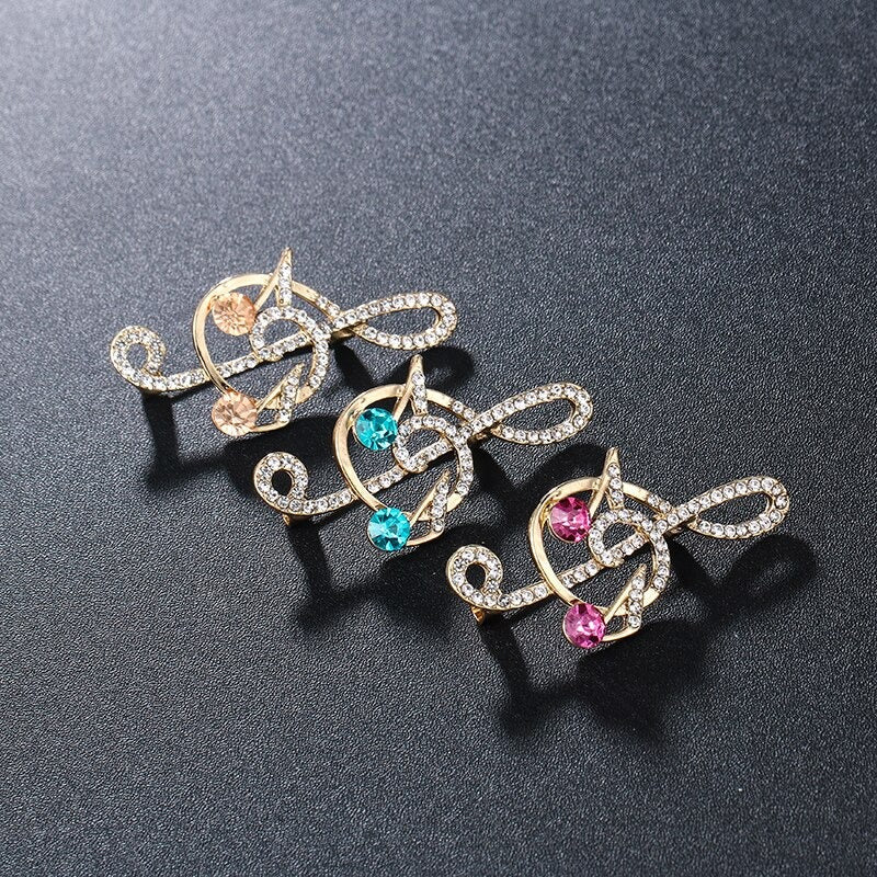 Elegante mit Strasssteinen und Perlen verzierte Broschennadeln mit Musikzeichen