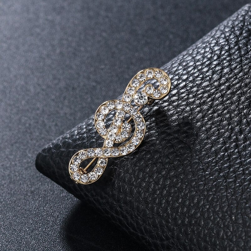 Elegante mit Strasssteinen und Perlen verzierte Broschennadeln mit Musikzeichen