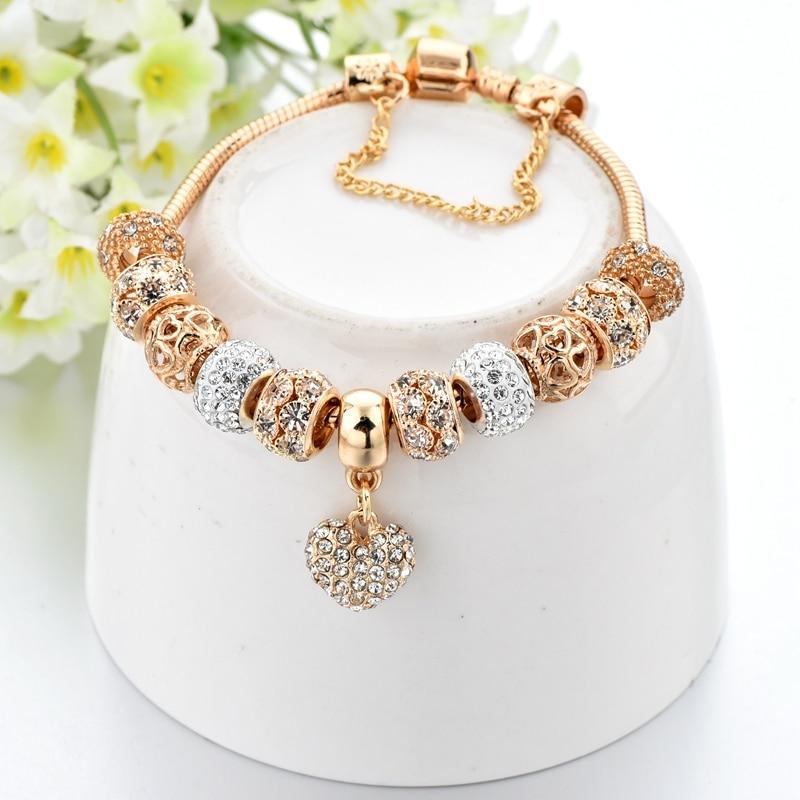 Exklusives Charm-Armband mit Herz aus Gold und Nieten