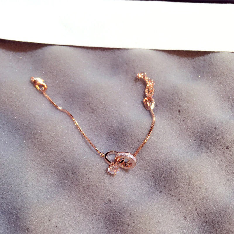 Exquisites, ineinander verschlungenes Doppelzirkon-Charm-Armband