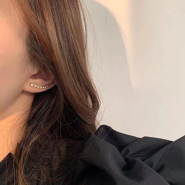 Exquisite, mit Strasssteinen besetzte Ohrringe mit Sternquaste