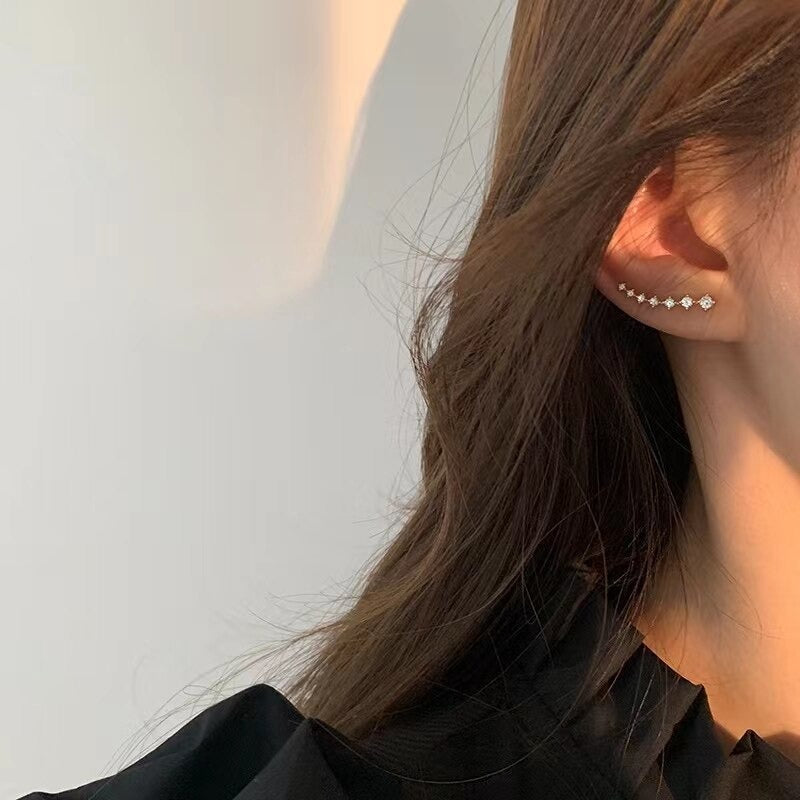Exquisite, mit Strasssteinen besetzte Ohrringe mit Sternquaste