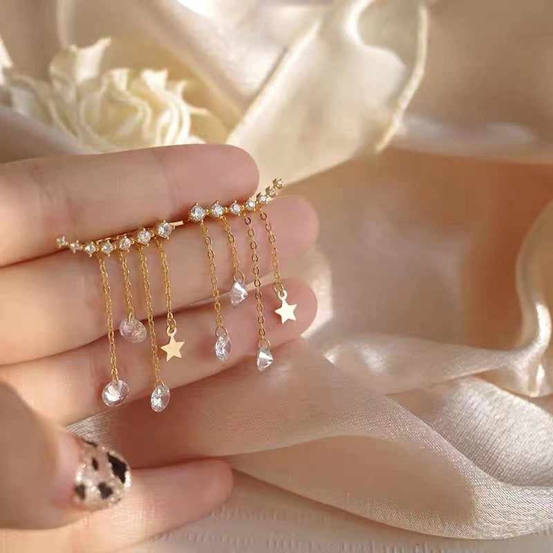 Exquisite, mit Strasssteinen besetzte Ohrringe mit Sternquaste