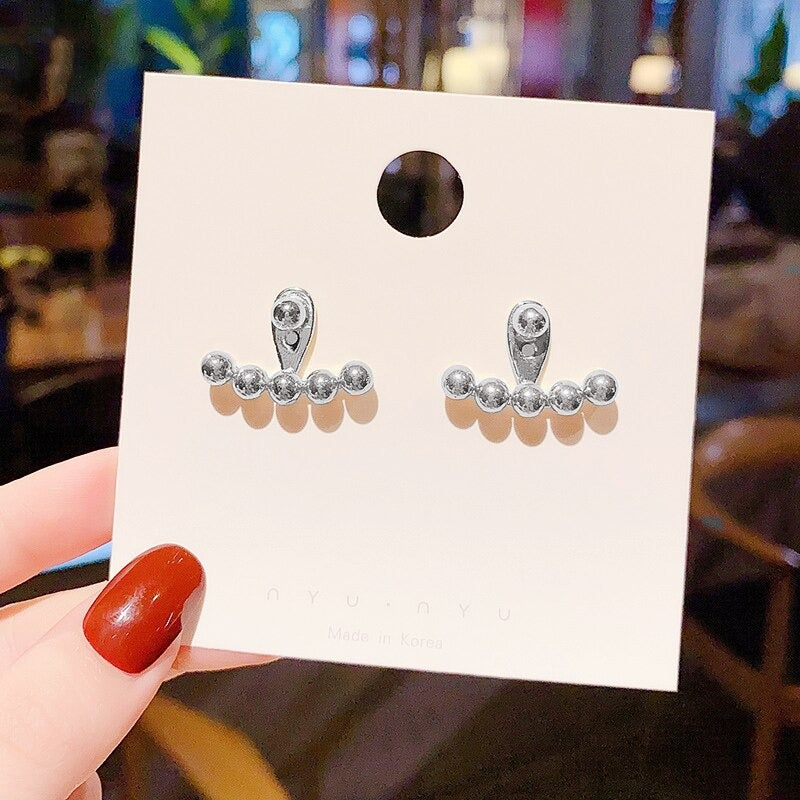 Modekollektionen von Tropfenohrringen mit Strasssteinen und Perlenquasten