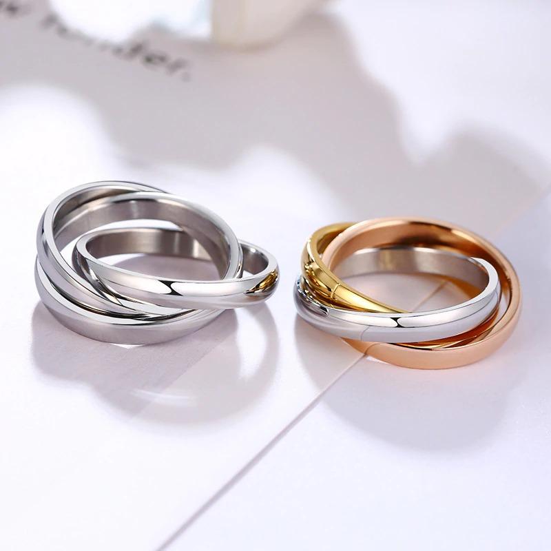 Glamouröse dreifarbige ineinander verschlungene Ringe