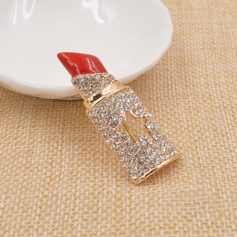 Glänzende Strass-Lippenstift-Brosche mit Promi-Motiv