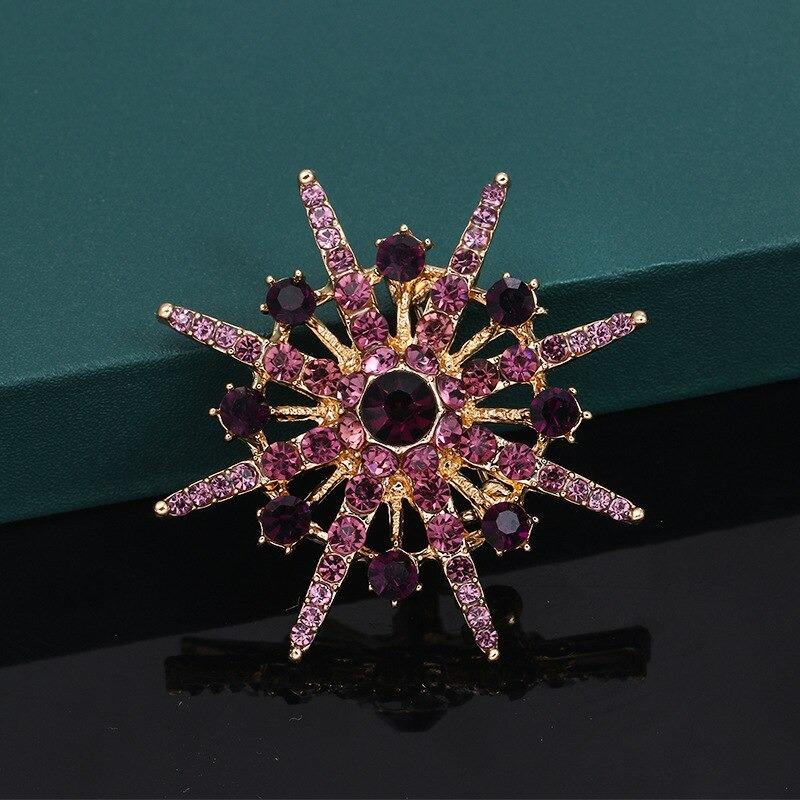Glänzende Strass-Starburst-Schmuckbrosche
