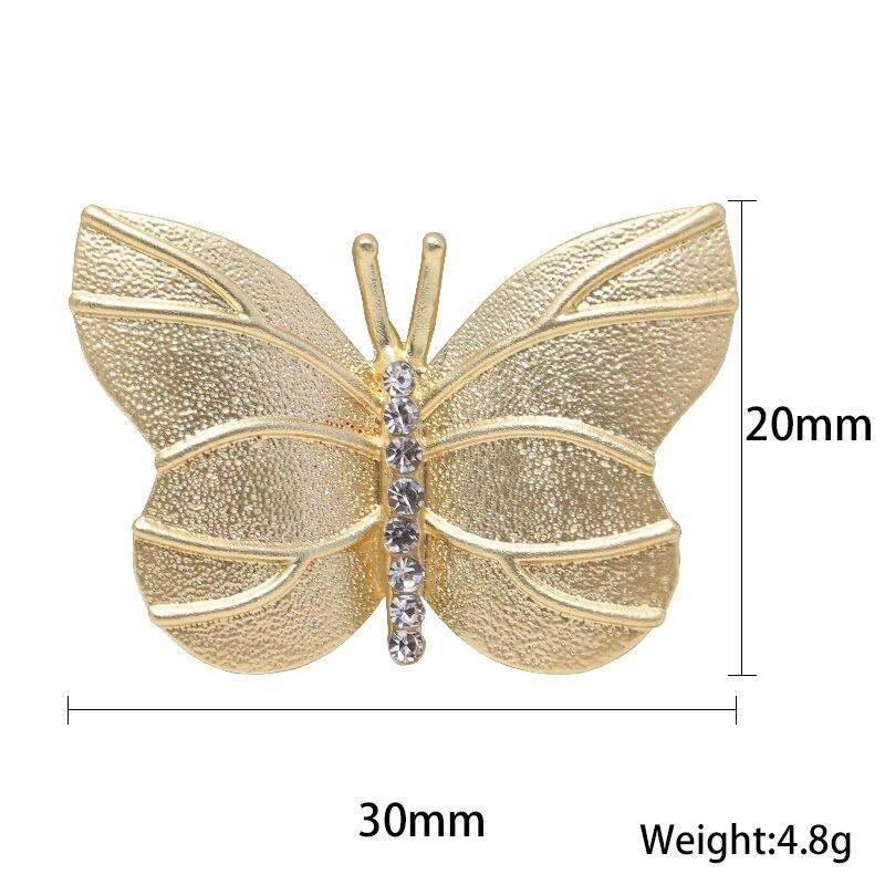 Kollektion goldener Broschennadeln mit Strasssteinen und Perlen