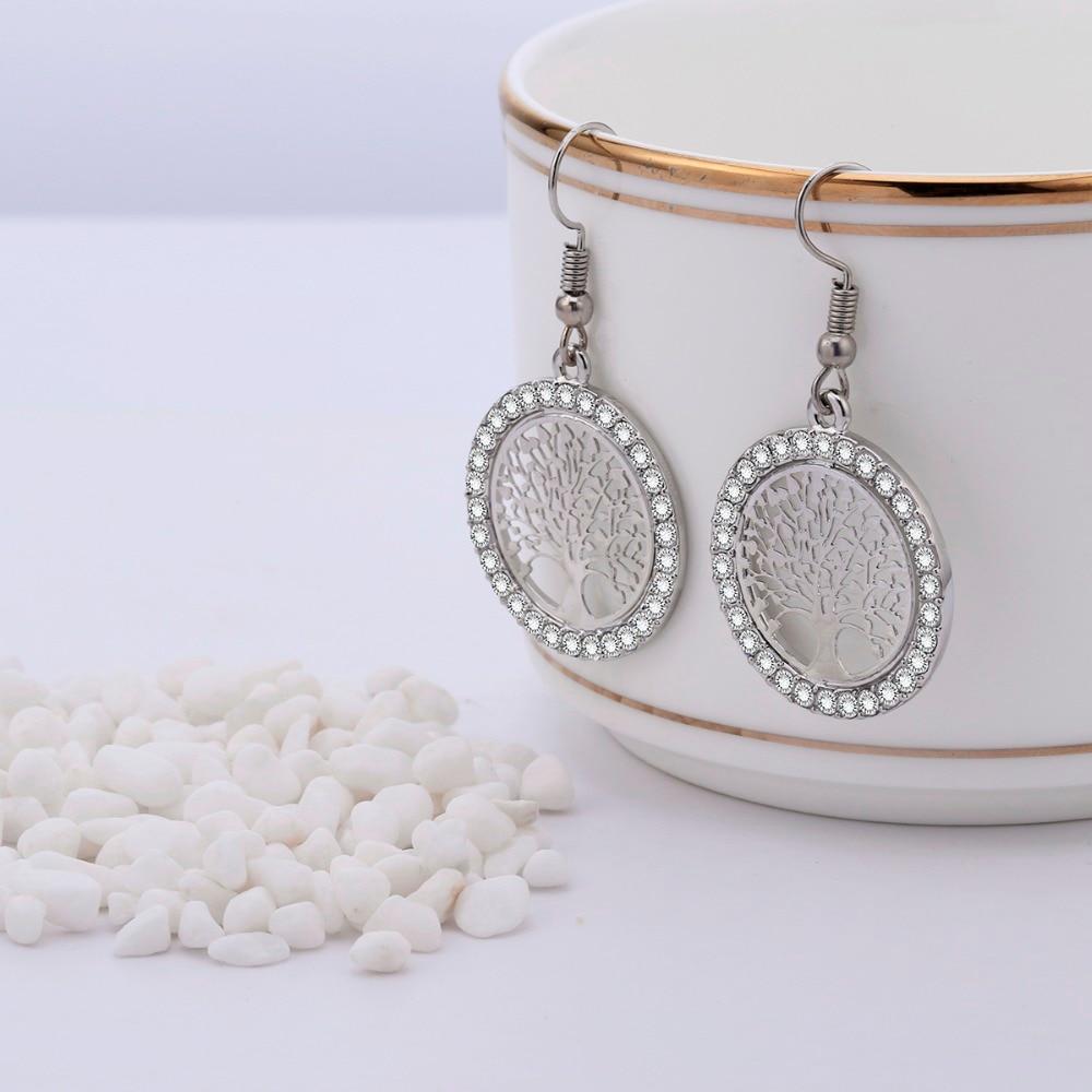 Ausgehöhlte Ohrhänger mit Lebensbaum-Nieten