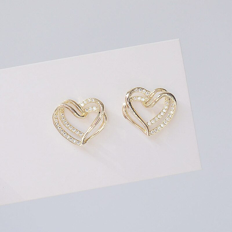 Filigrane doppellagige Ohrstecker mit hohlem Zirkonia in Herzform