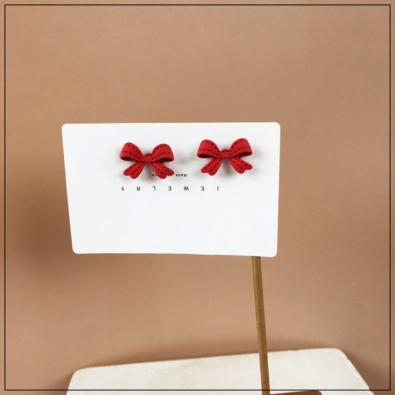 Jolly Chic – Rote Ohrringe mit Schleife