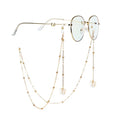 Brille mit goldener Kette und Perlen- und Silberakzenten