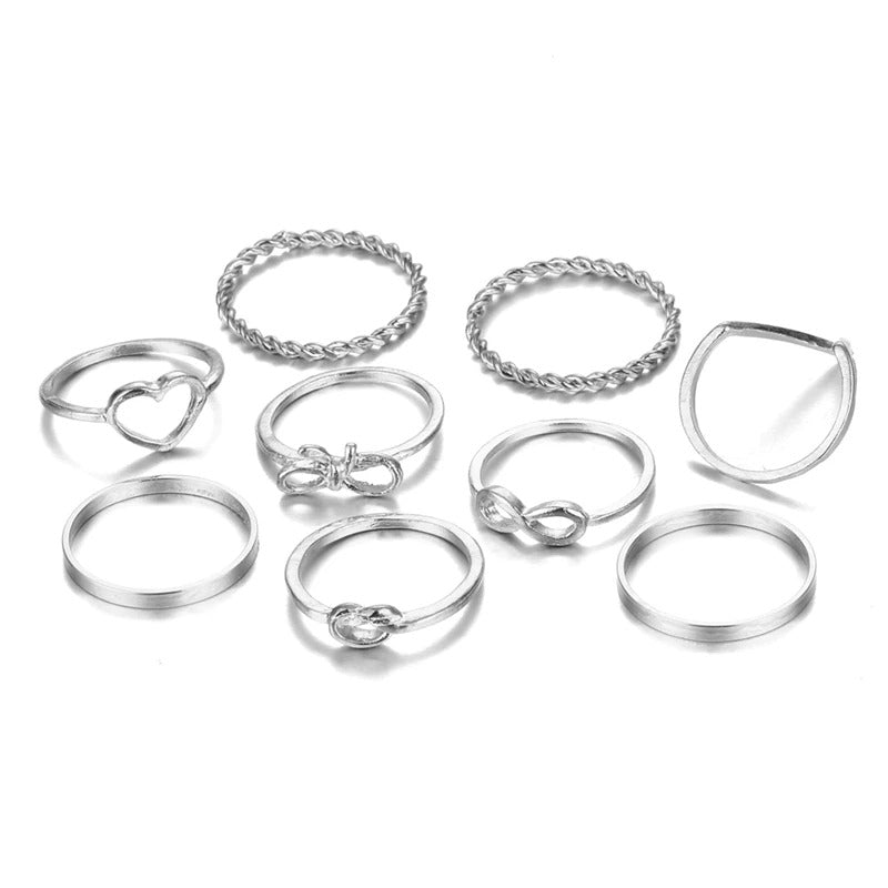 Offenes Ringset mit geometrischen Kreuzverdrehungen in mehreren Stilen