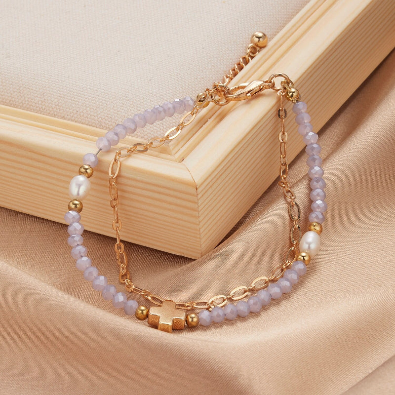 Mehrschichtige Perlen- und Kettenarmband-Schmuckkollektion mit Perlenanhängern