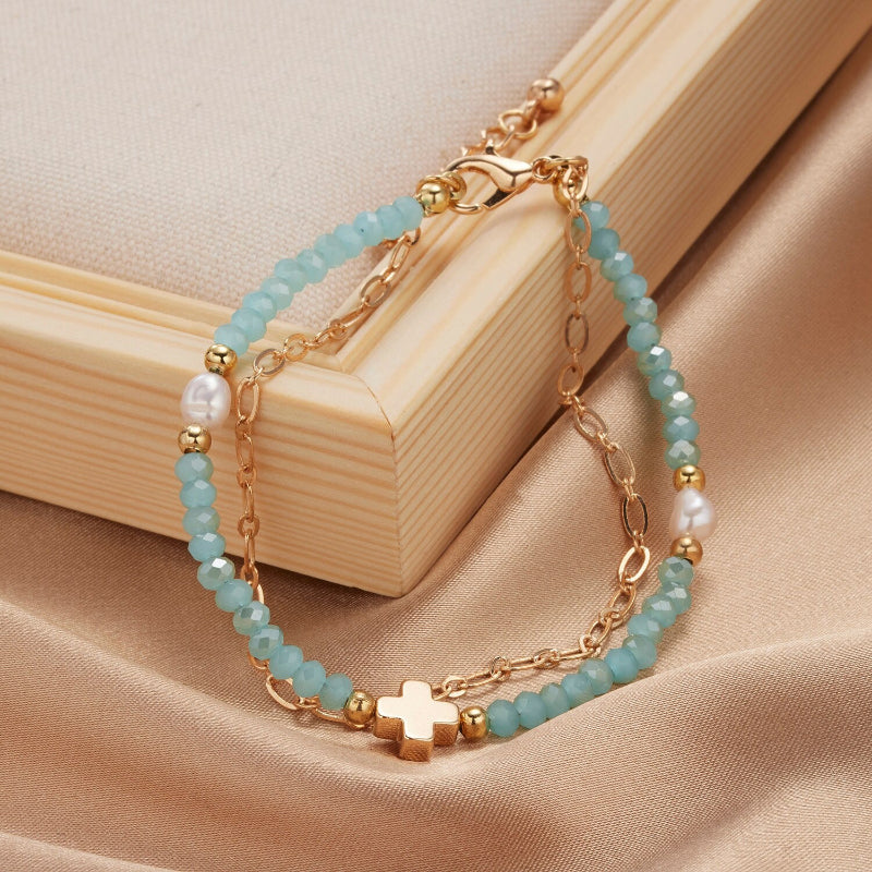 Mehrschichtige Perlen- und Kettenarmband-Schmuckkollektion mit Perlenanhängern