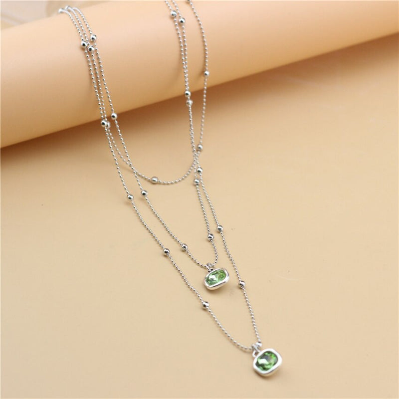 Schmuckset mit Halskette, Ohrringen und Armband in Retro-Quadratform mit Strasssteinen