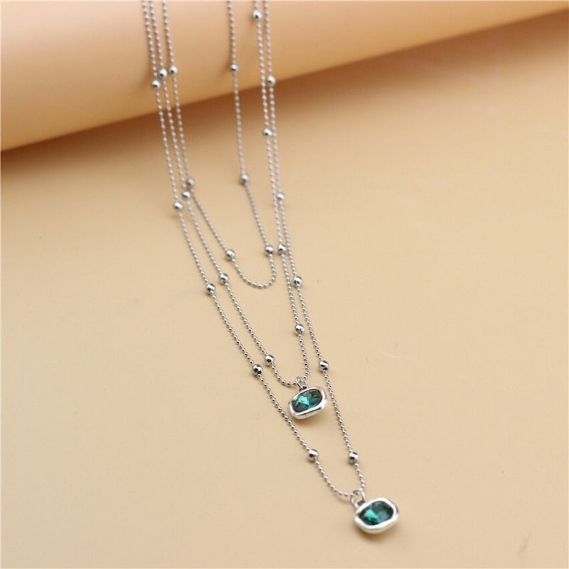 Schmuckset mit Halskette, Ohrringen und Armband in Retro-Quadratform mit Strasssteinen