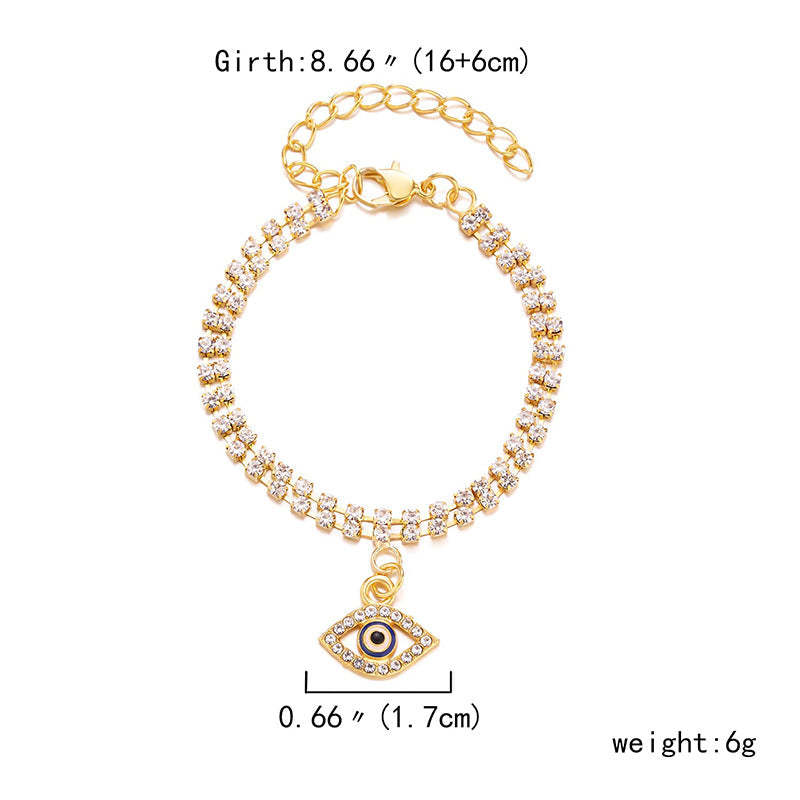 Mit Strasssteinen besetzte Hamsa-Hände und blaue Glücksaugen-Charm-Armbänder