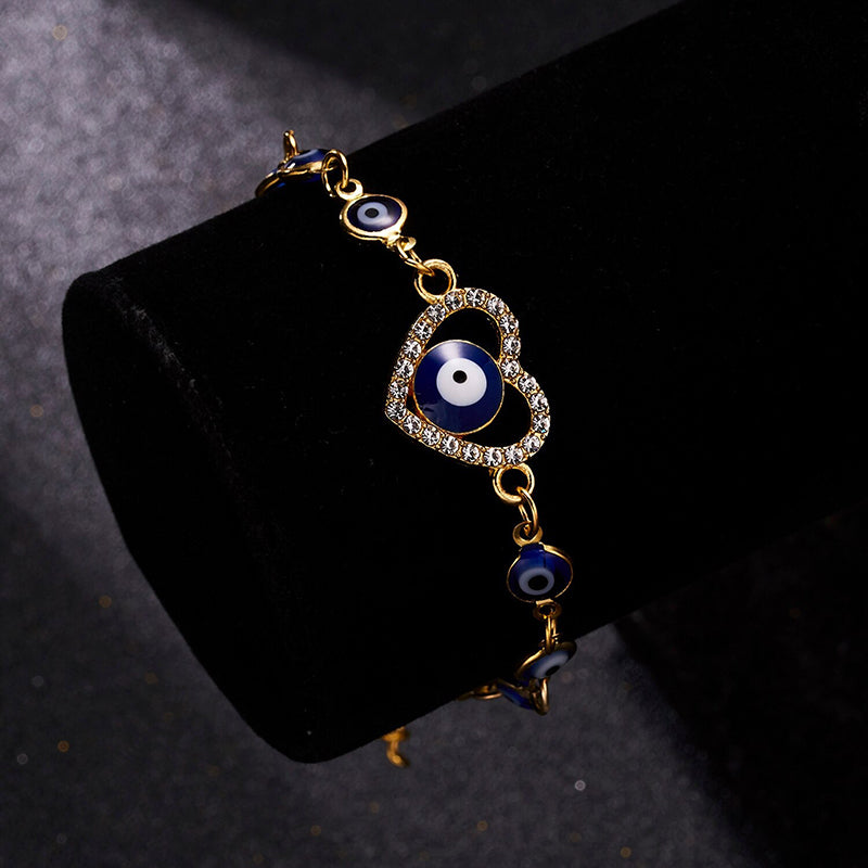 Mit Strasssteinen besetzte Hamsa-Hände und blaue Glücksaugen-Charm-Armbänder